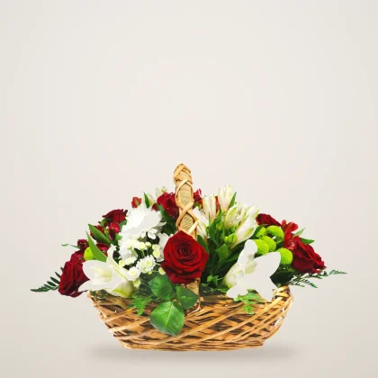 Red and white rose basket with red roses and white alstroemeria in a wicker basket