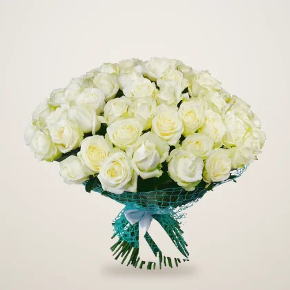 Hand-tied bouquet of white roses in green mesh with a blue ribbon